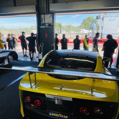 Pit crew huddled over the G55 in the garage, diagnostic laptop open, chasing the electrical fault