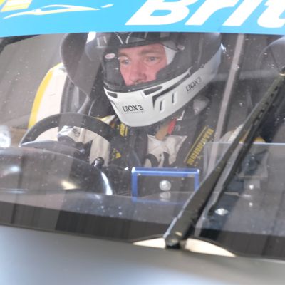 The G55 GT4 storms through Donington National Circuit under race light